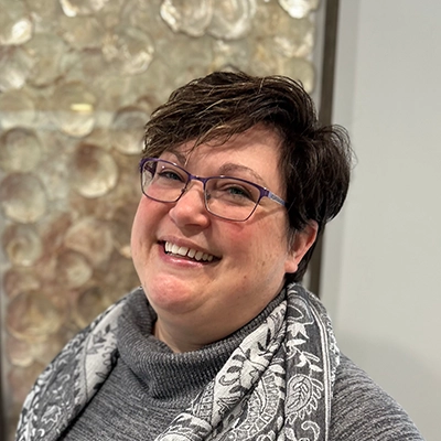 Michelle smiling, she has short hair.